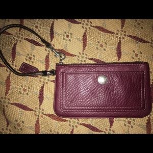 Coach burgundy large wristlet w/ outer &zip pocket